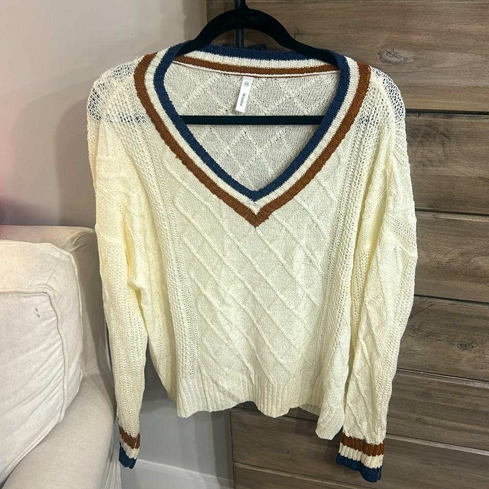 Cream boutique sweater. Orange and blue stripes